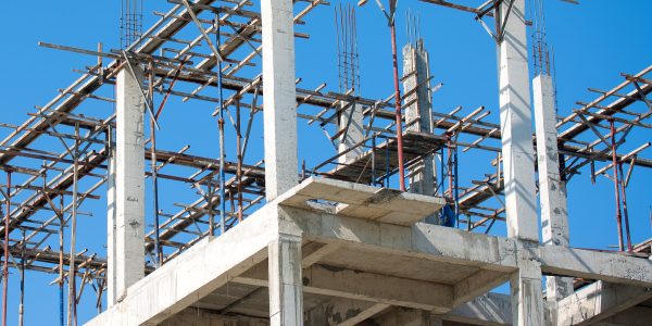 Building construction site work against blue sky
